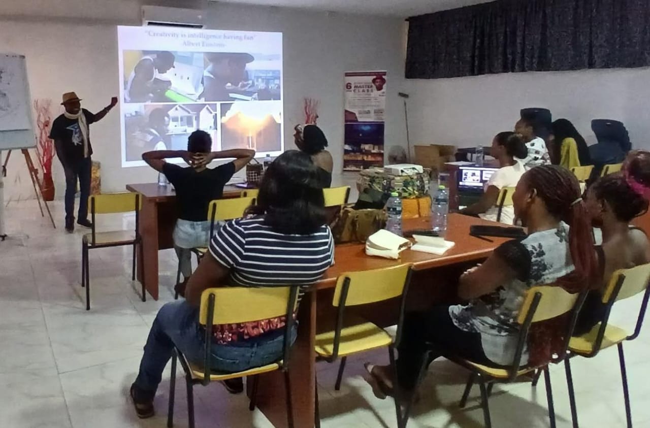 Prince Kojo-Hilton teaching a creative design masterclass to a full classroom