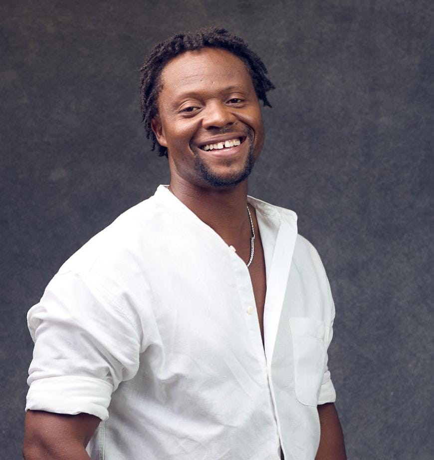 Nii-Tete Yartey smiling in a white shirt
